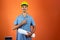 Engineers day - Black Man in Safety Helmet and Blue Shirt isolated. Engineer Holding Photovoltaic Solar Panel