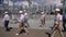 Engineers in helmets walk along road at electric substation