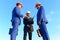 Engineers hold meeting on blue sky background. Board of architects