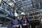 Engineers inside oil-refinery