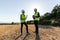 Engineers install and test a windmill farm operation.