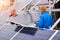 Engineers installing solar panels in winter