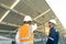 Engineers with investor walk to check the operation of the solar farmsolar panel systems, Alternative energy to conserve the