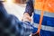 Engineers shaking hands at construction site. Construction worker in protective uniform shaking hands with businessman at