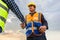 Engineers shaking hands at construction site, Construction worker in protective uniform shaking hands with businessman at