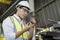 Engineers or technicians inspecting parts of industrial machinery. Staff or technicians are checking the operation of the old