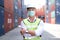 Engineers workers wear a safety vest and mask to prevent coronavirus in container area