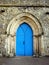 England: Cartmel Priory church blue door