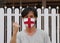 England flag on hygienic mask. Masked the man prevent germs. Tiny Particle protection or virus corona or Covid19. Lift the fist up