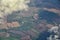 England rural landscape, fields, meadows and clouds. Aerial view from airplane of endless lush pastures and farmlands. Beautiful E