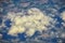 England rural landscape, fields, meadows and clouds. Aerial view from airplane of endless lush pastures and farmlands. Beautiful E