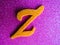 An English alphabet Z pink background shiney