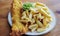 English battered Cod Fish and Chips with Mushy Peas in a plate