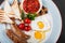 English breakfast - Fried eggs, beans, sausage, grilled tomatoesEnglish breakfast - Fried eggs, beans, sausage, grilled tomatoes,