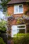 English brick house with vines