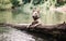 English bull terrier plays in the water in a mountain lake