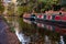 English canal narrow boats with Autumn fall leaves on trees