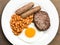 English Cooked Breakfast Fried Egg Sausages Baked Beans and Hamburger