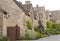 English Cotswolds houses with flowering summer gardens