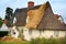 English Cottage being thatched