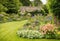 An English cottage garden with an abundance of blooming flowers