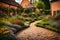 English cottage garden in the backyard, green grass and colorful flowering plants, brown paving and an orange brick wall,