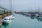 English country sea side with boats and mountain view.