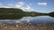 English countryside lake District Ullswater with white clouds and blue sky on beautiful still summer day