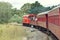 English Electric DE507 diesel locomotive pulling train with passengers