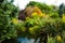 English garden with a water feature and flower boarders