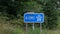 English motorway sign for the A1M with graphics in blue and white