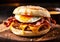 English muffin sandwich with crispy bacon, fried egg and melted cheese. AI generated