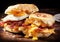 English muffin sandwich with crispy bacon, fried egg and melted cheese. AI generated