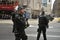 English policemen with machine guns in London , England