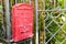 English red mailbox hang on gate