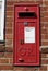 English Red postbox mounted on wall