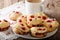 English sconces biscuits with red currants are served with tea a