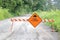 English Sign and Flooded Rural Road