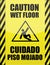 English and Spanish wet floor sign