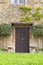 English stone cottage with brown wood doors