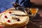 English-style pancakes with berries, traditional for Shrove Tuesday. Traditional classic thin golden flapjack on the plate and