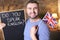 English teacher holding British flag