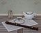 English teacup with saucer and teapot fine bone china porcelain, metronome for music and a block flute on a sheet of music