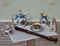 English teacup with saucer, teapot, sugar bowl and cream jug, fine bone china porcelain, metronome for music and a block flute on