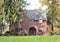 English Tudor Home with Pine Trees