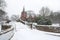 English village bridge in winter snow.