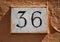 Engraved building number (36)