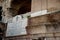 Engraved marble sign on side of colosseum for Amphiteatre Flavium