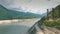 The Enguri hydroelectric power station HES. Inguri River next to Enguri Dam, surrounded by mountains