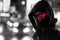 Enigmatic Figure in Hood with Red LED Visor